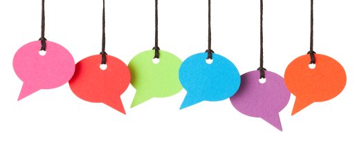 Six blank speech bubbles hanging from thread